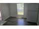 Bright kitchen featuring a white refrigerator and a window offering ample natural light at 3644 N Parker Ave, Indianapolis, IN 46218