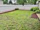 Green backyard with new mulch and a privacy fence, perfect for outdoor activities and relaxation at 3645 Winings Ave, Indianapolis, IN 46221