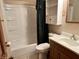 Bathroom featuring shower, vanity, toilet, and cabinet storage at 3645 Winings Ave, Indianapolis, IN 46221