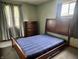 Comfortable bedroom with neutral walls, natural light, and hardwood flooring, perfect for relaxation at 3645 Winings Ave, Indianapolis, IN 46221