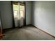 Cozy bedroom with large window providing ample natural light at 3645 Winings Ave, Indianapolis, IN 46221