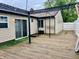 Wooden deck featuring a pergola and sliding glass door with backyard access at 3645 Winings Ave, Indianapolis, IN 46221