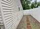 Exterior side view of home with well-kept yard and stone pathway at 3645 Winings Ave, Indianapolis, IN 46221