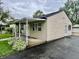 Single-story home exterior featuring covered porch and long driveway at 3645 Winings Ave, Indianapolis, IN 46221