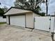 Detached one car garage with white siding and a white garage door at 3645 Winings Ave, Indianapolis, IN 46221