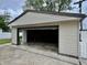 One car garage with an open door showing storage space at 3645 Winings Ave, Indianapolis, IN 46221