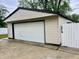 Spacious detached garage with a white door, providing ample parking and storage at 3645 Winings Ave, Indianapolis, IN 46221
