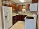 Well-lit kitchen with lots of storage cabinets, modern appliances, and beautiful tiled backsplash at 3645 Winings Ave, Indianapolis, IN 46221