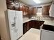 Cozy kitchen with stainless steel appliances, ample cabinet space, and tile backsplash at 3645 Winings Ave, Indianapolis, IN 46221