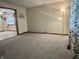 Living room featuring neutral walls, updated carpet, and plenty of natural light at 3645 Winings Ave, Indianapolis, IN 46221