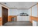 Clean and organized finished basement featuring vinyl plank flooring, wood trim and great lighting at 38 Hawthorne Ct, Carmel, IN 46033