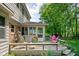 Inviting wooden deck with colorful seating, offering a perfect spot for outdoor dining and enjoying the serene backyard view at 38 Hawthorne Ct, Carmel, IN 46033