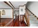 Spacious foyer featuring beautiful hardwood floors and a classic staircase at 38 Hawthorne Ct, Carmel, IN 46033