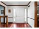 Welcoming foyer with gleaming hardwood floors and elegant trim at 38 Hawthorne Ct, Carmel, IN 46033