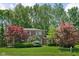 Charming two-story home with mature landscaping and a well-manicured lawn at 38 Hawthorne Ct, Carmel, IN 46033