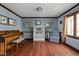 Cozy living room with light-blue walls and hardwood floors at 38 Hawthorne Ct, Carmel, IN 46033