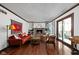 Cozy living room with a brick fireplace, built-in shelving, and sliding doors at 38 Hawthorne Ct, Carmel, IN 46033