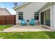 Back patio features two blue adirondack chairs and a small table at 4256 Zachary Ln, Westfield, IN 46062