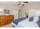 Bedroom with a large dresser and views into an ensuite bathroom at 4256 Zachary Ln, Westfield, IN 46062