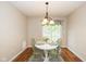 Bright dining area featuring a white table set for two with stylish decor and natural light at 4256 Zachary Ln, Westfield, IN 46062