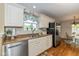 Modern kitchen featuring white cabinetry, stainless steel appliances, and updated countertops at 4256 Zachary Ln, Westfield, IN 46062