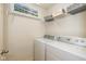 Laundry room with front-loading washer and dryer and shelving at 4256 Zachary Ln, Westfield, IN 46062