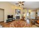 Cozy living room featuring a fireplace, high ceiling, and a round decorative rug at 4256 Zachary Ln, Westfield, IN 46062