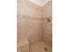 Walk-in shower featuring tilework and a built-in bench at 4256 Zachary Ln, Westfield, IN 46062