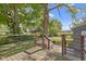 Backyard view from the wooden deck showcases the natural setting at 4359 Winthrop Ave, Indianapolis, IN 46205