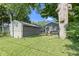 Expansive backyard showcases the detached garage and patio at 4359 Winthrop Ave, Indianapolis, IN 46205
