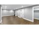 Finished basement with neutral walls, wood-look flooring and recessed lighting at 4359 Winthrop Ave, Indianapolis, IN 46205