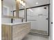 This bathroom features a shower, double sink vanity and neutral paint at 4359 Winthrop Ave, Indianapolis, IN 46205