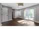 Bedroom includes sliding glass doors, a closet, wood flooring and neutral paint at 4359 Winthrop Ave, Indianapolis, IN 46205
