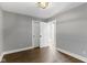 This bedroom features wood flooring, an closet and a doorway leading to another room at 4359 Winthrop Ave, Indianapolis, IN 46205