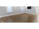 Bright living room with hardwood floors, freshly painted walls, and updated trim at 4359 Winthrop Ave, Indianapolis, IN 46205