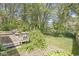 Relaxing outdoor deck overlooks a backyard with mature trees and lush greenery, perfect for entertaining at 4622 S Franklin Rd, Indianapolis, IN 46239