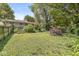 Expansive backyard with lush greenery, mature trees, and a home with an inviting deck at 4622 S Franklin Rd, Indianapolis, IN 46239