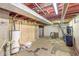 Unfinished basement with a water heater and plumbing fixtures at 4622 S Franklin Rd, Indianapolis, IN 46239