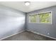 Bright bedroom with large windows offering ample natural light and neutral walls at 4622 S Franklin Rd, Indianapolis, IN 46239