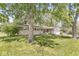 Beautiful single-story home with a well-manicured lawn and mature trees in the front yard at 4622 S Franklin Rd, Indianapolis, IN 46239