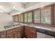 Kitchen with cooktop, dishwasher, and many windows providing natural light at 4622 S Franklin Rd, Indianapolis, IN 46239