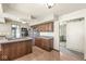 Spacious eat-in kitchen with island cooktop, wood floors, stainless appliances and ample cabinet space at 4622 S Franklin Rd, Indianapolis, IN 46239