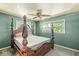 Main bedroom featuring a decorative ceiling fan, windows with natural light, and neutral walls at 4622 S Franklin Rd, Indianapolis, IN 46239