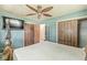 Main bedroom with spacious closets, neutral paint, and an open doorway to an adjoining room at 4622 S Franklin Rd, Indianapolis, IN 46239
