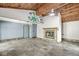 Large recreation room featuring a fireplace, wood ceiling, and slate floors at 4622 S Franklin Rd, Indianapolis, IN 46239