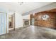 Large recreation room featuring a fireplace, wood-panel accents, and slate floors at 4622 S Franklin Rd, Indianapolis, IN 46239