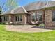 Backyard brick patio is perfect for entertaining or relaxing outdoors at 5200 W Shoreline Ter, Muncie, IN 47304