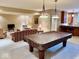 Finished basement featuring a pool table and a cozy seating area at 5200 W Shoreline Ter, Muncie, IN 47304