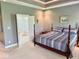A bright, primary bedroom suite leads into the spacious bathroom with an open doorway at 5200 W Shoreline Ter, Muncie, IN 47304
