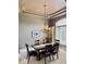 Dining room featuring a modern chandelier, a large window and stylish décor at 5200 W Shoreline Ter, Muncie, IN 47304